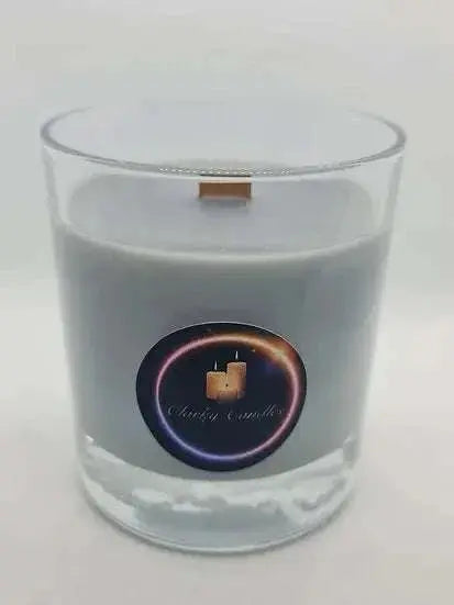 Sauvage Wood Wick scented soy wax candle in clear glass container with warm amber and musk fragrance