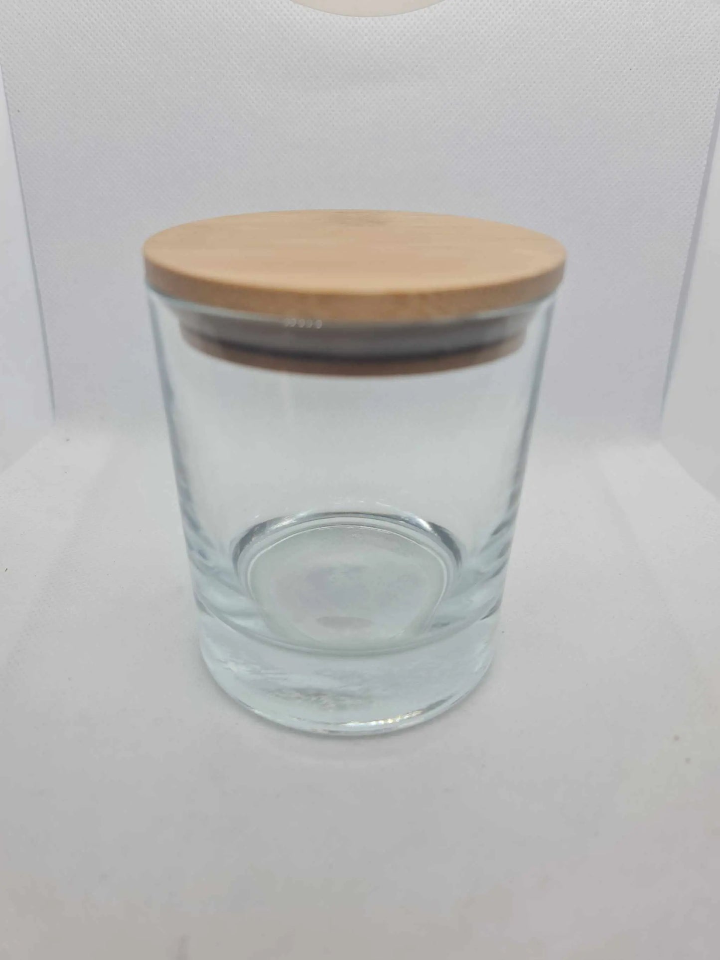 Bamboo candle glass lid with natural bamboo cover and silicon insert on clear glass container