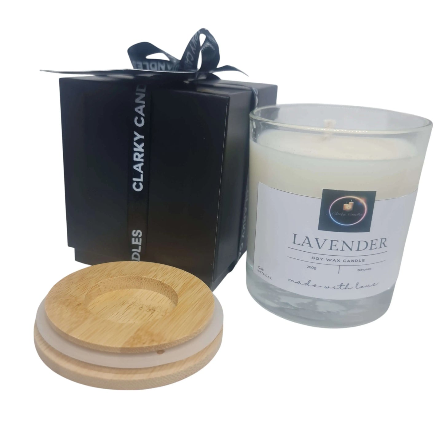 Lavender Luxury Scented Candle in glass jar with bamboo lid, gift-wrapped black box, perfect for relaxation and gifts.