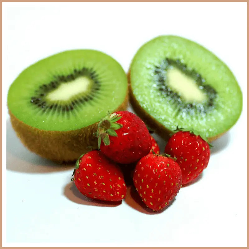 Fresh strawberries and halved kiwi fruit representing Strawberry & Kiwi scented soy wax candle fragrance
