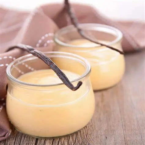 Vanilla Cream Scented Sizzlers in glass jars with vanilla beans, creamy yellow color, cozy home fragrance product