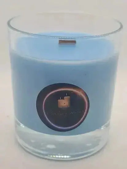 Blue bubblegum scented soy wax candle with wood wick in clear glass container