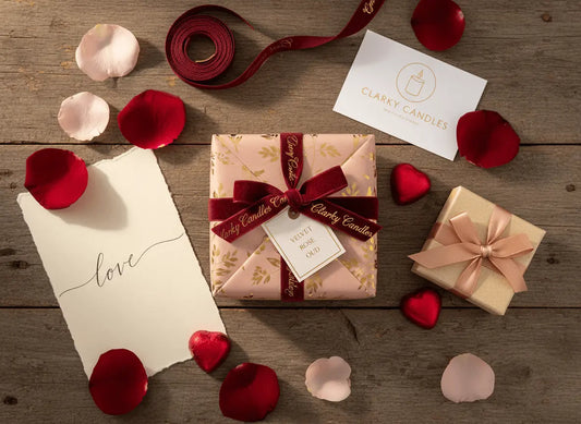 Unique Valentine's gifts 2026 UK with beautifully wrapped presents and rose petals on rustic wooden surface.