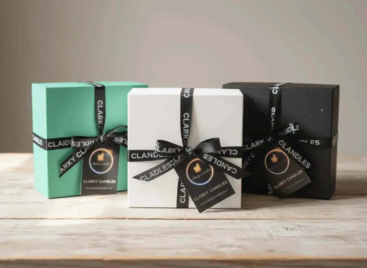 Three stylishly packaged 3 Wick Bowls Candles in mint green, white, and black with elegant ribbons and labels.
