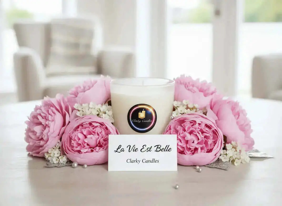 Scented candles arrangement with pink flowers and a label, showcasing Clarky Candles from the scented candles collection.