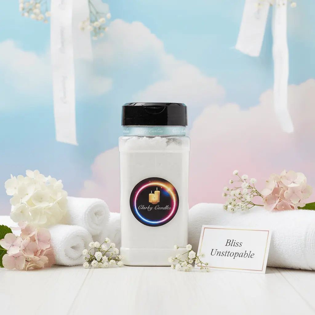 Bliss Unstoppable carpet freshener 500g bottle surrounded by flowers and towels, creating a serene ambiance.