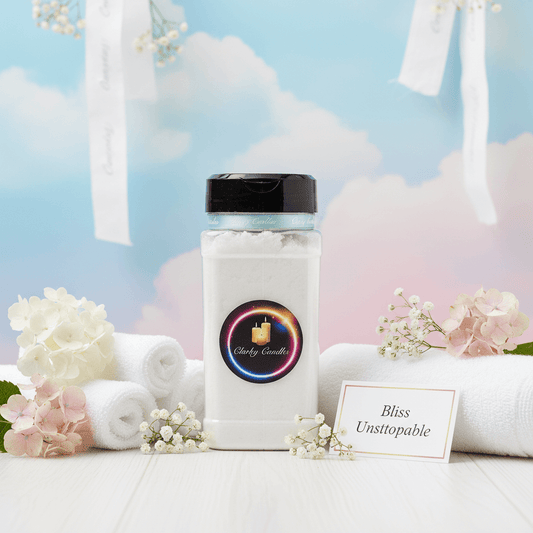 Bliss Unstoppable carpet freshener 500g bottle surrounded by flowers and towels, creating a serene ambiance.