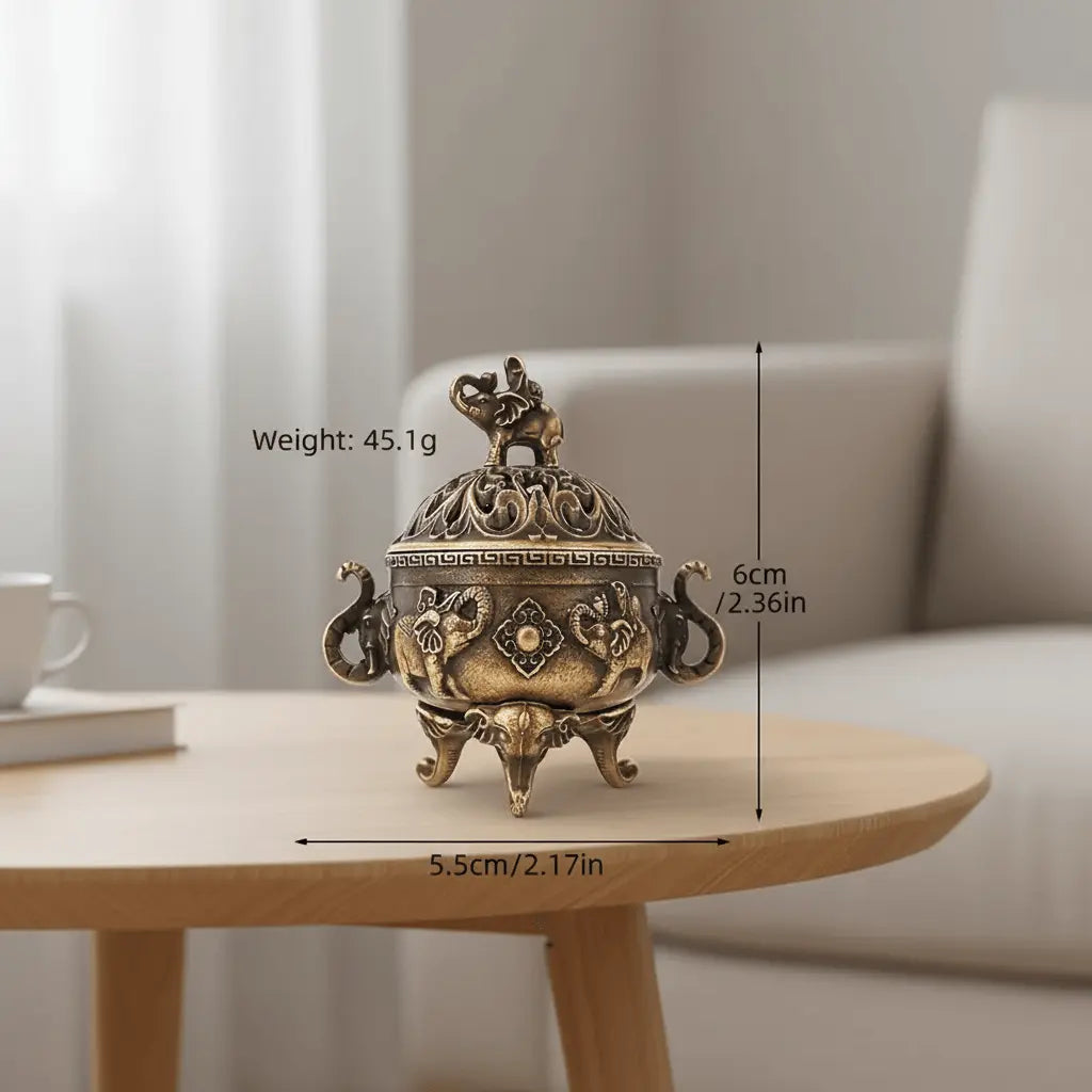 Elephant Vintage-Inspired Incense Burner on a table, ornate lidded design with detailed elephant lid and handles.