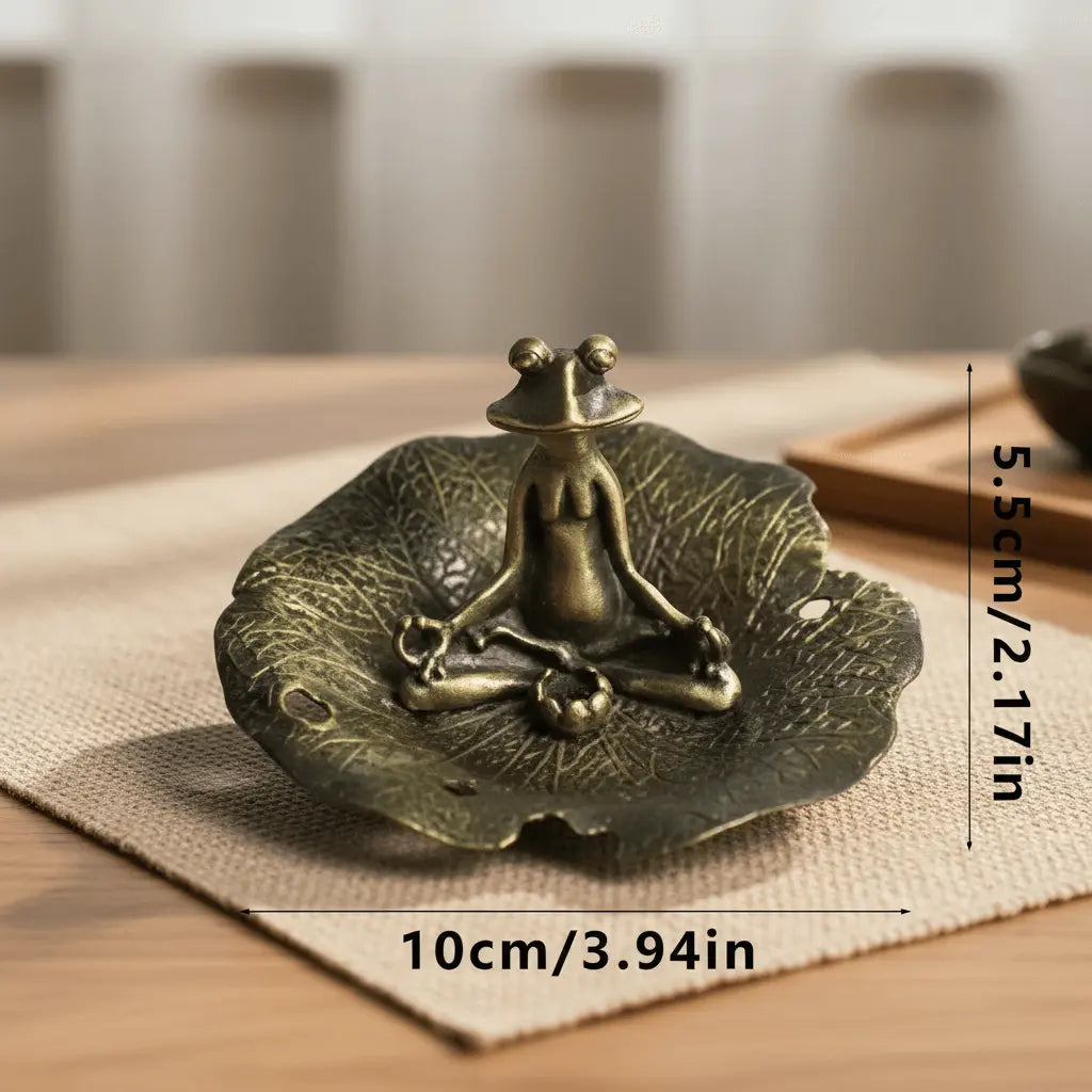 Frog on Lotus Leaf Incense Stick Holder featuring a meditating frog on a lotus leaf dish.