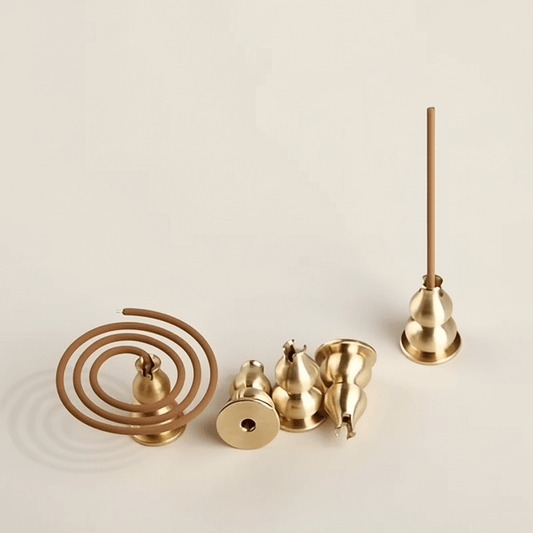 Small copper incense holder with gourd shape on a neutral background