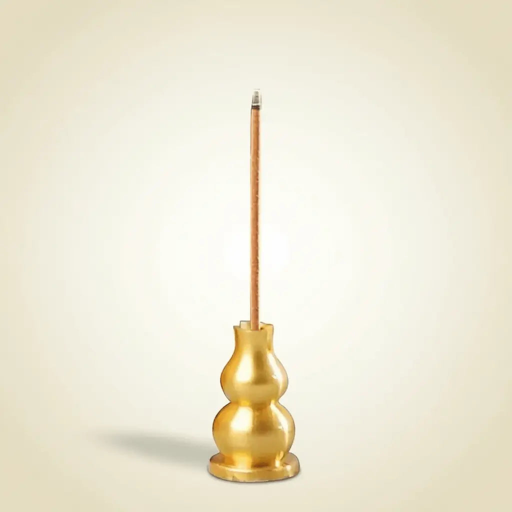 Incense Holder in small copper design with wooden handle for burning incense sticks safely and stylishly.
