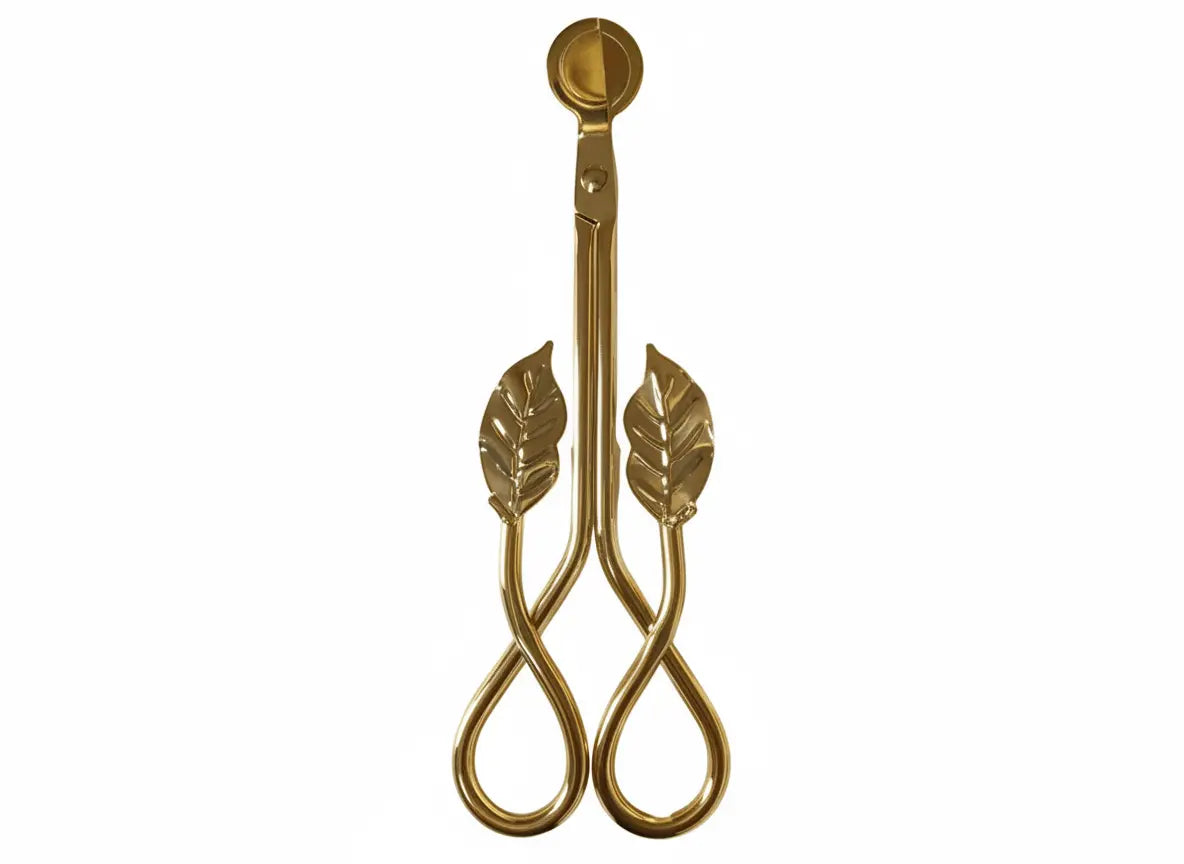 Top-down view of Gold Leaf Wick Trimming Scissors with decorative leaf handles, a premium candle care tool from Clarky Candles.