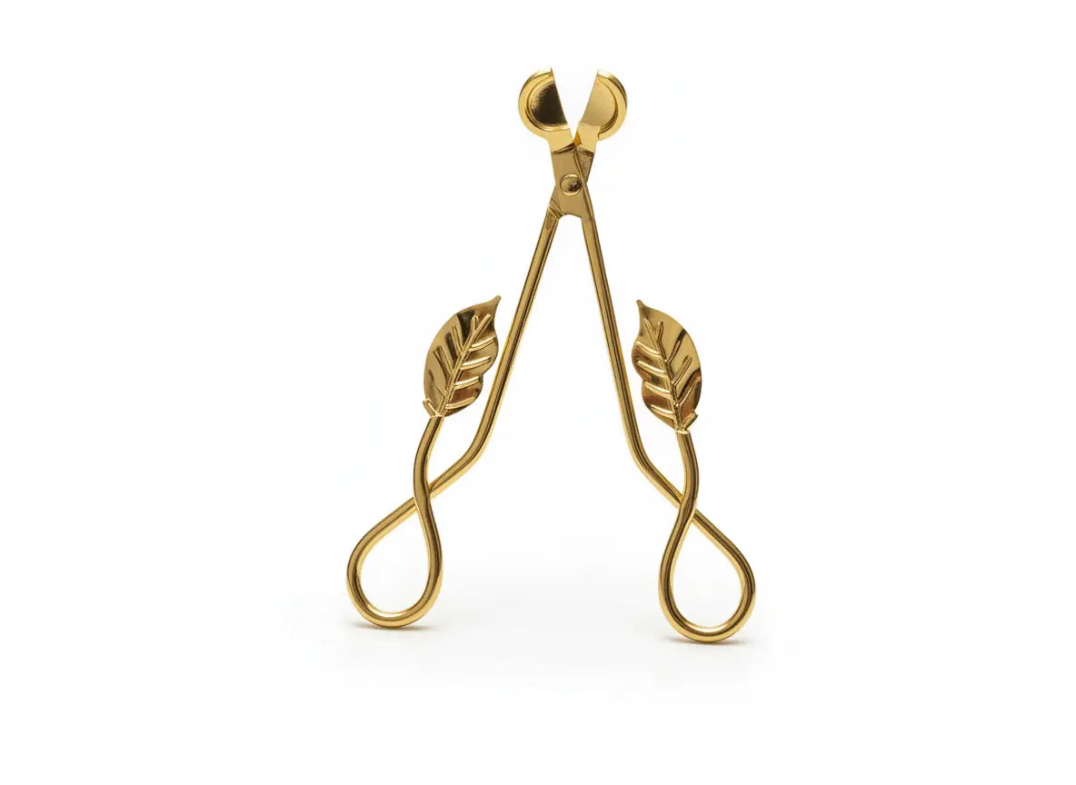 Gold Leaf Wick Trimming Scissors standing upright on a white background, featuring elegant leaf-shaped handles – premium candle care accessory from Clarky Candles.