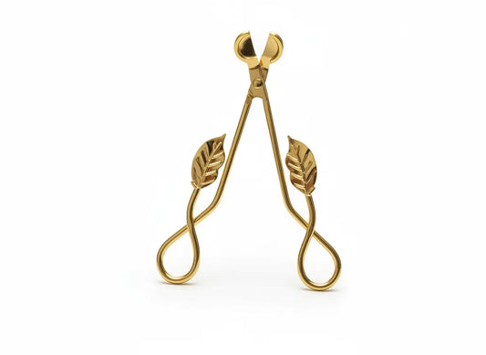 Gold Leaf Wick Trimming Scissors standing upright on a white background, featuring elegant leaf-shaped handles – premium candle care accessory from Clarky Candles.