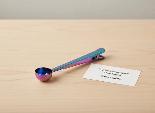 Clip Scooping Spoon - Multi Colour on a wooden surface next to a product information card from Clarky Candles.