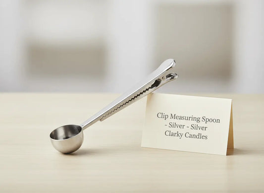 Clip Scooping Spoon Silver on a table with a label, showcasing its precise design and dual functionality.