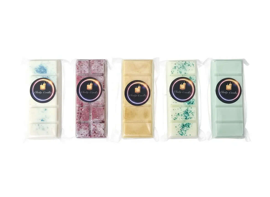 Five varieties of wax melt snap bars in clear packaging, showcasing different colors and fragrances.